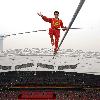 AHDILI LIVES THE HIGH-WIRE LIFE Thrill-seeker Ahdili gingerly crosses a tightrope high above China's famous Bird's Nest – as he bids to spend 60 days living in a tiny cabin on the roof.  Daredevil Ahdili, hailed as the Prince of Tightrope Walking in his native country, crossed from one side of the Beijing National Stadium to the other as nervous onlookers watched from below.  He is planning a feat of endurance – by living in a nine-metre box on top of the arena for the next two months to set a new world record. (ZN/WN)