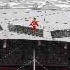 AHDILI LIVES THE HIGH-WIRE LIFE Thrill-seeker Ahdili gingerly crosses a tightrope high above China's famous Bird's Nest – as he bids to spend 60 days living in a tiny cabin on the roof.  Daredevil Ahdili, hailed as the Prince of Tightrope Walking in his native country, crossed from one side of the Beijing National Stadium to the other as nervous onlookers watched from below.  He is planning a feat of endurance – by living in a nine-metre box on top of the arena for the next two months to set a new world record. (ZN/WN)