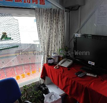 AHDILI LIVES THE HIGH-WIRE LIFE Thrill-seeker Ahdili gingerly crosses a tightrope high above China's famous Bird's Nest – as he bids to spend 60 days living in a tiny cabin on the roof.  Daredevil Ahdili, hailed as the Prince of Tightrope Walking in his native country, crossed from one side of the Beijing National Stadium to the other as nervous onlookers watched from below.  He is planning a feat of endurance – by living in a nine-metre box on top of the arena for the next two months to set a new world record. (ZN/WN)