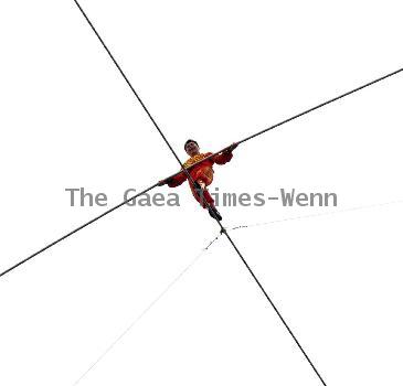 AHDILI LIVES THE HIGH-WIRE LIFE Thrill-seeker Ahdili gingerly crosses a tightrope high above China's famous Bird's Nest – as he bids to spend 60 days living in a tiny cabin on the roof.  Daredevil Ahdili, hailed as the Prince of Tightrope Walking in his native country, crossed from one side of the Beijing National Stadium to the other as nervous onlookers watched from below.  He is planning a feat of endurance – by living in a nine-metre box on top of the arena for the next two months to set a new world record. (ZN/WN)