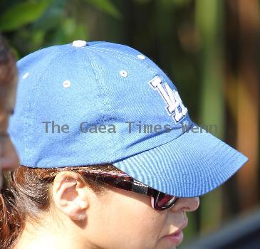 Eva Mendez leaves a gym in West Hollywood by walking out backwards then covering her face with a dog bowl to hide form the photographersLos Angeles.