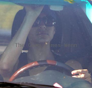 Eva Mendez leaves a gym in West Hollywood by walking out backwards then covering her face with a dog bowl to hide form the photographersLos Angeles.