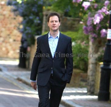 Nick Clegg leaves his house to make a statement regarding the U.K. General Elections in front of the press London.