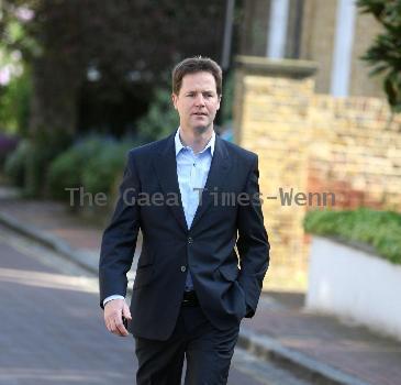 Nick Clegg leaves his house to make a statement regarding the U.K. General Elections in front of the press London.