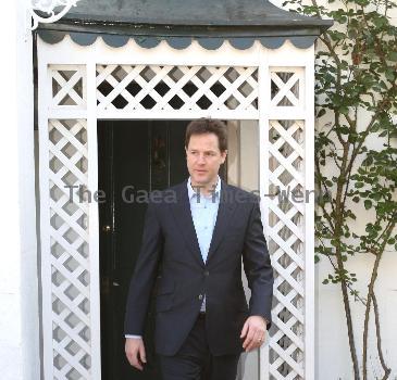 Nick Clegg leaves his house to make a statement regarding the U.K. General Elections in front of the press London.