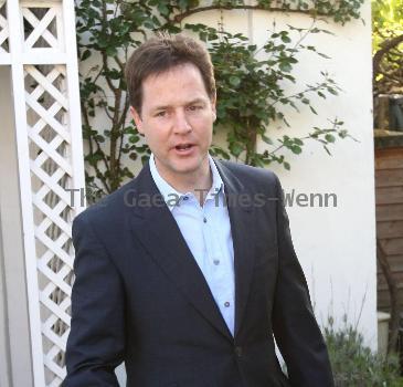 Nick Clegg leaves his house to make a statement regarding the U.K. General Elections in front of the press London.