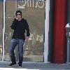 Brandon Davis 
smokes a cigarette while talking on his cell phone in Little Santa Monica, Beverly Hills.
Los Angeles, California.