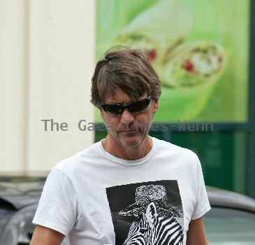 Richard Madeley 
is greeted by Kim Medcalf while out shopping in Golders Green.
London, England.