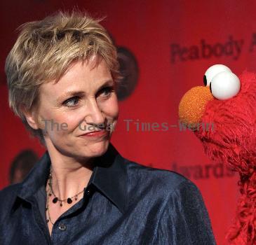 Actress Jane Lynch and Elmo 
attend the 69th Annual Peabody Awards at The Waldorf Astoria
 New York City,