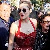 Marion Cotillardis escorted by bodyguards as she walks along the Croisette during the 63rd Cannes Film FestivalCannes.