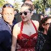 Marion Cotillardis escorted by bodyguards as she walks along the Croisette during the 63rd Cannes Film FestivalCannes.