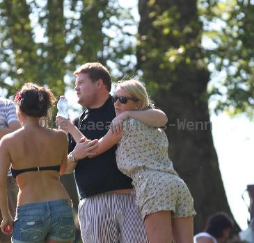 James Corden and Julia Carey
embrace while spending an afternoon relaxing with friends in Primrose Hill park
London, England.