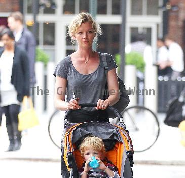 Gretchen Mol pushing her son, Ptolemy John Williams, in a stroller while out and about in SoHo New York City.