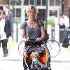 Gretchen Mol pushing her son, Ptolemy John Williams, in a stroller while out and about in SoHo New York City.