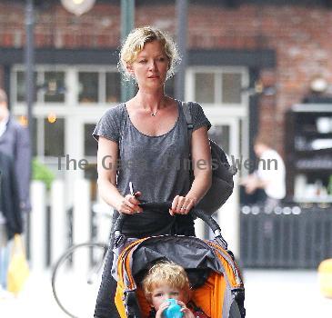 Gretchen Mol pushing her son, Ptolemy John Williams, in a stroller while out and about in SoHo New York City.