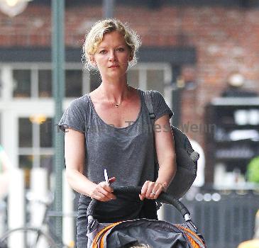 Gretchen Mol pushing her son, Ptolemy John Williams, in a stroller while out and about in SoHo New York City.