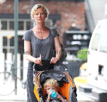 Gretchen Mol pushing her son, Ptolemy John Williams, in a stroller while out and about in SoHo New York City.