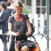 Gretchen Mol pushing her son, Ptolemy John Williams, in a stroller while out and about in SoHo New York City.