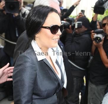 Lindsay Lohan going through the metal detector Lindsay Lohan arriving at the Beverly Hills Courthouse where she is scheduled to appear today for violating her probation, missing a court date last week and completing only 10 of her 13 court-ordered alcohol education classes, stemming from a 2007 DUI arrest.Los Angeles, California - 24.05.10 Mandatory Credit: IANS-WENN.
LOHAN ORDERED TO STAY IN LOS ANGELES, WEAR ANKLE BRACELET LINDSAY LOHAN may have lost another movie role thanks to her extended stay at the Cannes Film Festival in France - a judge has forbidden the actress from leaving Los Angeles.  Lohan appeared before Judge Marsha Revel on Monday morning (24May10) - five days after she failed to appear at a mandatory hearing - and was ordered to refrain from drinking or doing drugs for the foreseeable future.
  The judge, who initially issued a warrant for the star's arrest last Thursday (20May10) after she failed to show up, told Lohan she could remain free on bail, but she must wear a SCRAM device on her ankle and submit to random drug tests.
  Judge Revel also insisted the actress must attend weekly alcohol education classes.
  The lawmaker ruled that Lohan risked jail if she failed to comply with any of the stipulations of her bail.
  Lohan's lawyer, Shawn Chapman Holley, pointed out that the restrictions would prevent Lohan from travelling to Texas for a movie, but the judge was unsympathetic.
  The actress angered Judge Revel when she failed to show in court last week, claiming her passport had been stolen at the Cannes Film Festival and she was unable to get back to Los Angeles in time. She flew in on Sunday (23May10).
  In a pre-hearing interview with Hollywood.tv, Lohan insisted she didn't deserve jail time or a rehab stint.
  She said,