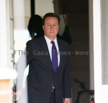 Prime Minister David Cameron
leaving his house wearing a Paul Smith