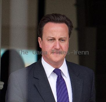 Prime Minister David Cameron
leaving his house wearing a Paul Smith