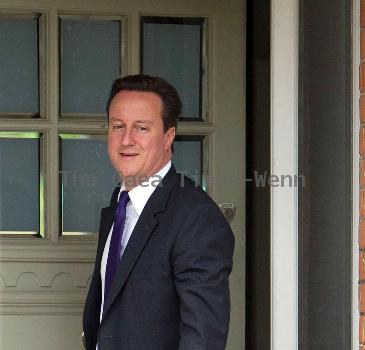 Prime Minister David Cameron
leaving his house wearing a Paul Smith