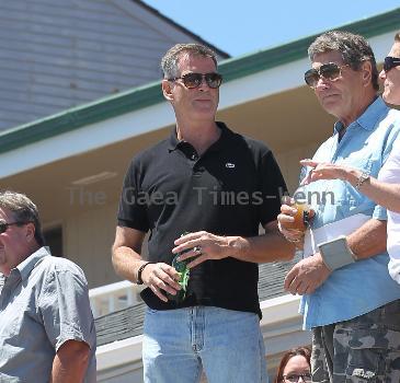 BEERS BROSNAN Former James Bond star Pierce Brosnan indulges in a cold beer on a sunny day in Malibu. The actor, immortalised as the trim superspy in 007 films including Die Another Day, is snapped holding his hand over what appears to be a bulging belly.Los Angeles.