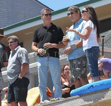 BEERS BROSNAN Former James Bond star Pierce Brosnan indulges in a cold beer on a sunny day in Malibu. The actor, immortalised as the trim superspy in 007 films including Die Another Day, is snapped holding his hand over what appears to be a bulging belly.Los Angeles.