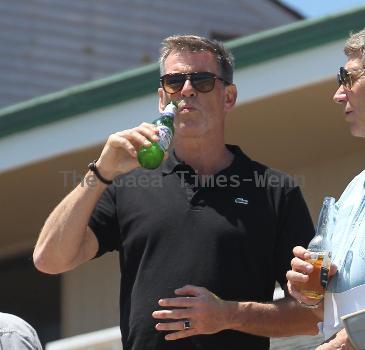 BEERS BROSNAN Former James Bond star Pierce Brosnan indulges in a cold beer on a sunny day in Malibu. The actor, immortalised as the trim superspy in 007 films including Die Another Day, is snapped holding his hand over what appears to be a bulging belly.Los Angeles.