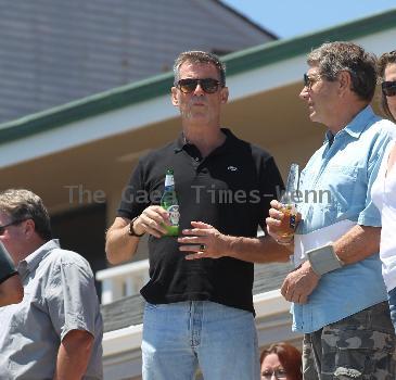 BEERS BROSNAN Former James Bond star Pierce Brosnan indulges in a cold beer on a sunny day in Malibu. The actor, immortalised as the trim superspy in 007 films including Die Another Day, is snapped holding his hand over what appears to be a bulging belly.Los Angeles.