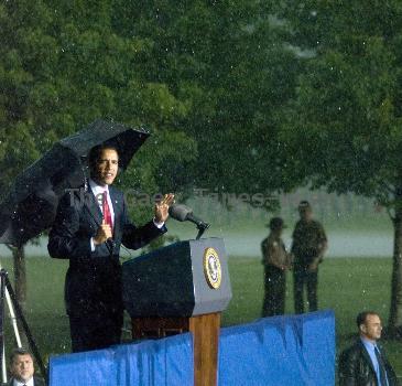 Torrential rain, lightning, thunder and strong winds forced President Barack Obama to cancel a Memorial Day speech he'd scheduled at the Abraham Lincoln National Cemetery.  Obama had mounted the podium to give the address when rain, thunder, lightning and high winds  began. Under the cover of a large umbrella, he told thousands gathered before him that