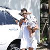 Halle Berry carries her sleeping daughter, Nahla Ariela Aubry, to attend a pool party in Hollywood Hills Los Angeles.