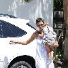 Halle Berry carries her sleeping daughter, Nahla Ariela Aubry, to attend a pool party in Hollywood Hills Los Angeles.