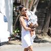 Halle Berry carries her sleeping daughter, Nahla Ariela Aubry, to attend a pool party in Hollywood Hills Los Angeles.