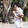 Halle Berry carries her sleeping daughter, Nahla Ariela Aubry, to attend a pool party in Hollywood Hills Los Angeles.