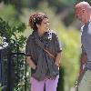 Marisa Tomei, wearing no makeup and sporting a rather noticeable love bite on her neck, walking with a friend in Hollywood. Los Angeles.