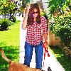 Eva Mendes, wearing plaid and jeans, walking her dog in Beverly Hills Los Angeles.