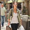 Trinny Woodall has her hands full while out shopping at The Grove in Hollywood. Trinny shops at Baby Gap and picks up an iPad at the Apple store.Los Angeles.