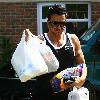 Peter Andre returns to his new house after buying some groceries from the local village store. Hove.