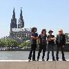 Alice in Chains posing outside Hyatt Hotel with river Rhein and the Cologne Cathedral (Koelner Dom) in the background. Cologne.