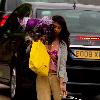 Konnie Huq The former Blue Peter presenter is the new host of ITV2's spin off show The Xtra Factor. Konnie with her hands full, carrying a suitcase, yellow selfridges bag, a bouquet of flowers, returns home from Glasgow, where auditions have begun. London.