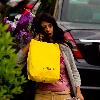 Konnie Huq The former Blue Peter presenter is the new host of ITV2's spin off show The Xtra Factor. Konnie with her hands full, carrying a suitcase, yellow selfridges bag, a bouquet of flowers, returns home from Glasgow, where auditions have begun. London.