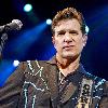 Singer Chris Isaak performing on stage during a concert Shepherds Bush Empire. The concert is part of the 2010 tour to promote his album 'Mr. Lucky'London.