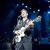 Singer Chris Isaak performing on stage during a concert Shepherds Bush Empire. The concert is part of the 2010 tour to promote his album 'Mr. Lucky'London.