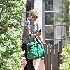 Amanda Seyfried carrying a green gym bag while leaving a friend's house in West Hollywood Los Angeles.