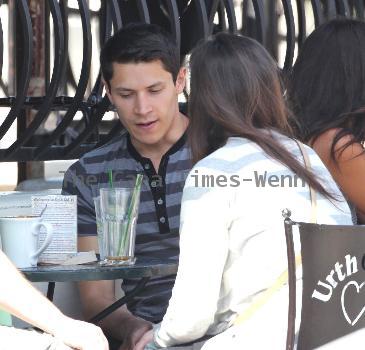 'Twilight' star Alex Meraz having a conversation with friends at Urth Cafe on Melrose Avenue Los Angeles.