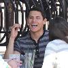 'Twilight' star Alex Meraz having a conversation with friends at Urth Cafe on Melrose Avenue Los Angeles.