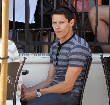 'Twilight' star Alex Meraz having a conversation with friends at Urth Cafe on Melrose Avenue Los Angeles.