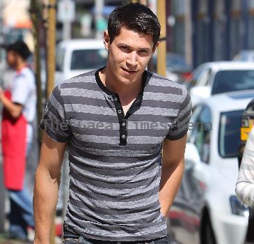 'Twilight' star Alex Meraz having a conversation with friends at Urth Cafe on Melrose Avenue Los Angeles.