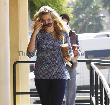 'Cougar Town' star Busy Philipps stops by Starbucks to get a large iced coffee Los Angeles.